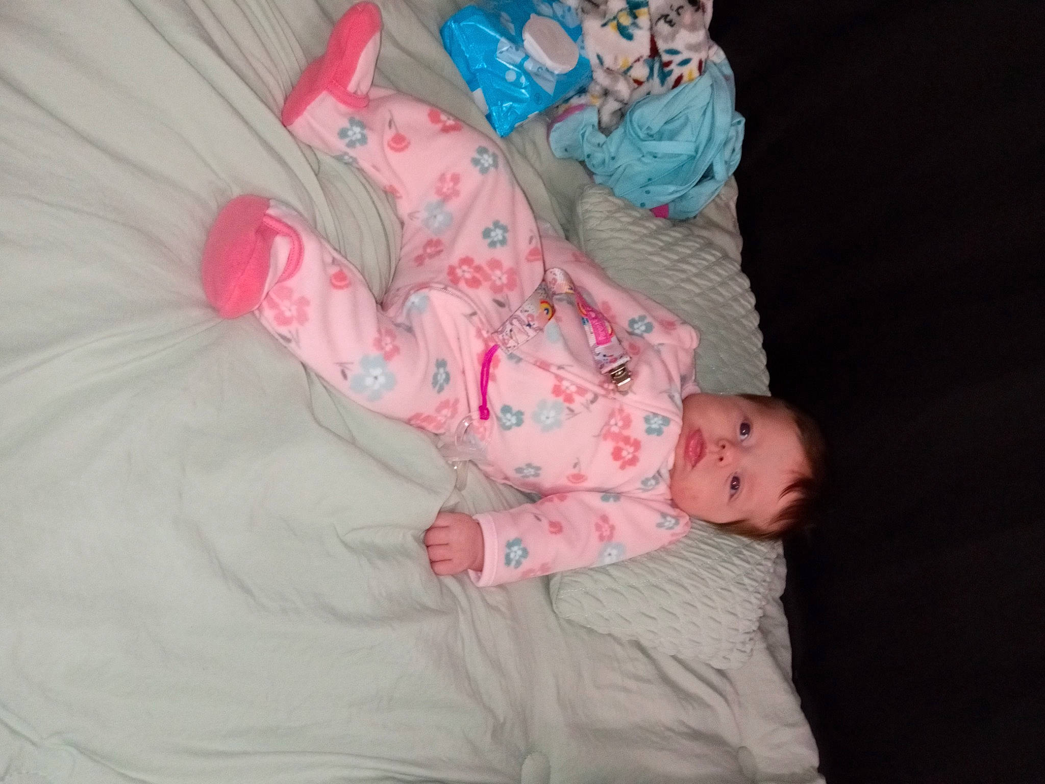 Peyton is registered to the contest to win money with this photo: art, baby, baby_products, baby_toddler_clothing, bedtime, child, comfort, human_leg, linens, nap, pattern, person, pink, plant, room, sitting, skin, sleeve, textile, toddler