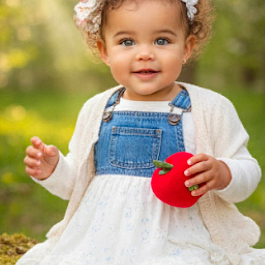 Camila is registered to the contest to win money with this photo: apple, boots, cardigan, child, curly_hair, denim, dress, forest, girl, happy, headband, log, moss, outdoor, plush_toy, portrait, sitting, striped_leggings, sunlight, toddler