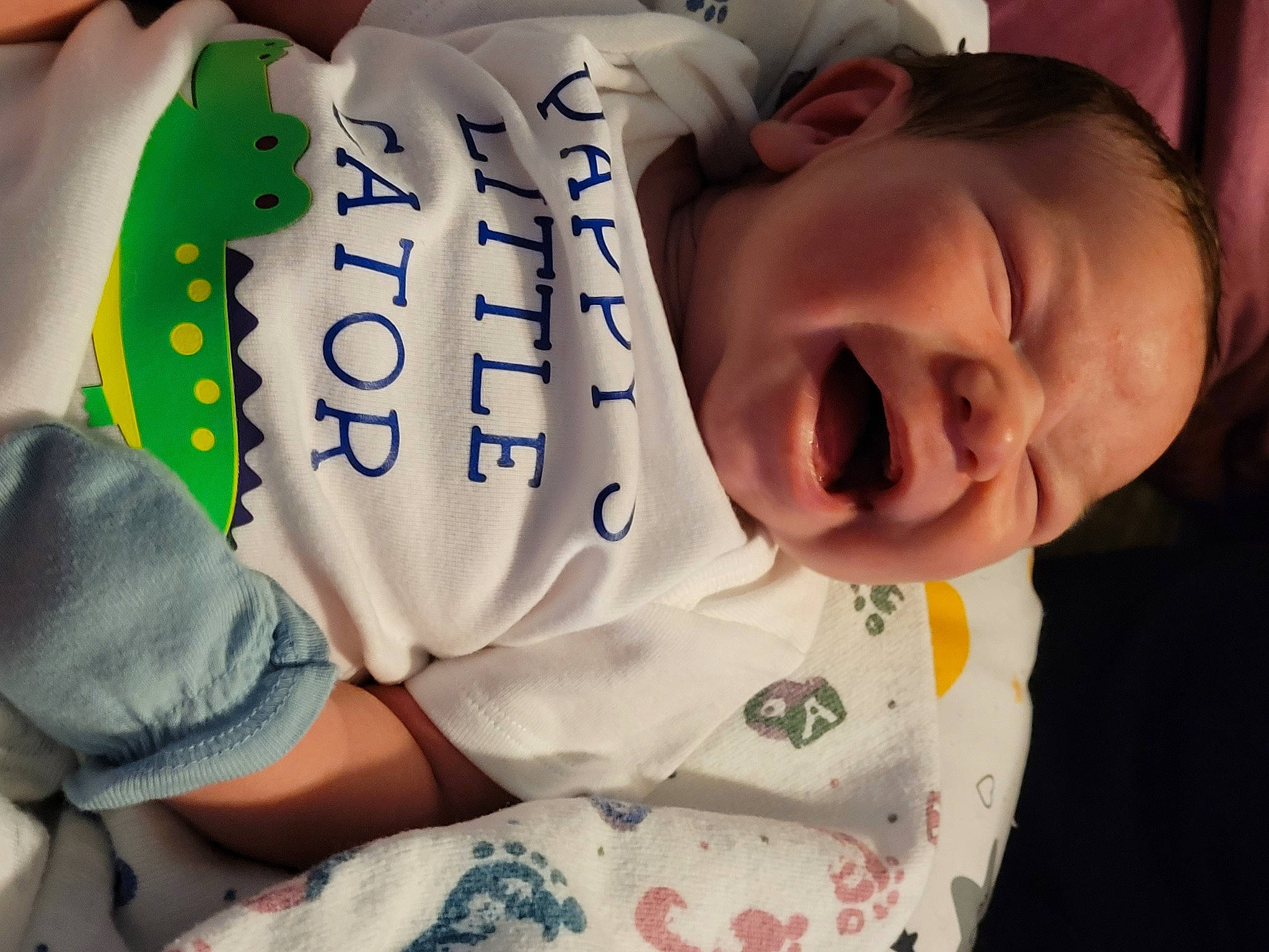 Atticus James is registered to the contest to win money with this photo: baby, baby_products, baby_sleeping, baby_toddler_clothing, cheek, child, chin, comfort, elbow, finger, happy, human_body, linens, mouth, neck, nose, person, skin, sleeve, smile