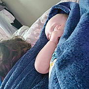 Maximus is registered to the contest to win money with this photo: baby, infant, sleeping, portrait, blanket, blue_blanket, bed, bedroom, cozy, peaceful, resting, closed_eyes, face, arm, hand, pajamas, bedding, indoors, soft_texture, nap