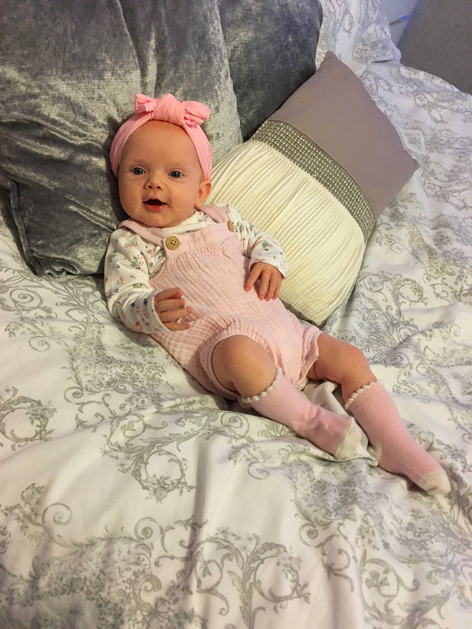 Aoife is registered to the contest to win money with this photo: abdomen, baby, baby_toddler_clothing, child, dress, hair_accessory, lace, leg, person, pink, skin, sleeve, textile, toddler, trunk