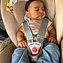 baby, bib, car_seat, child, clothing, cute, fabric, face, hands, head, indoors, infant, legs, napping, peaceful, rest, safety_harness, seat, sleeping, straps