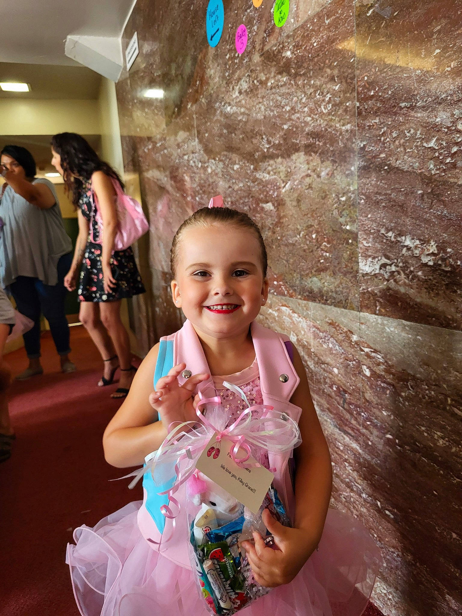 Kiley is registered to the contest to win money with this photo: child, dress, event, facial_expression, fashion_design, flash_photography, formal_wear, fun, happy, jewellery, joy, leisure, magenta, person, pink, recreation, sitting, skin, smile, summer