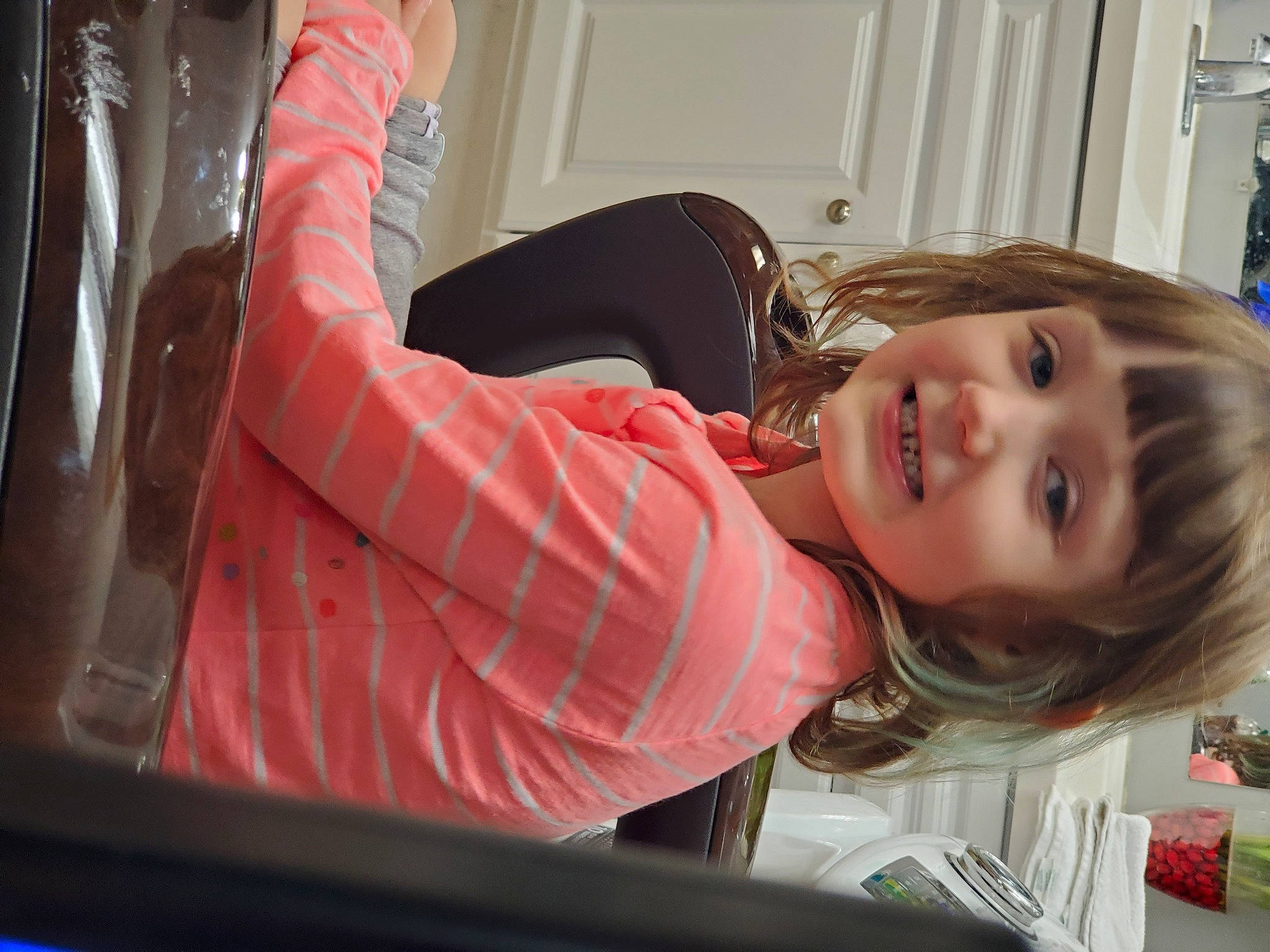 Annabell is registered to the contest to win money with this photo: blond, child, eyelash, glass, hair, hand, joy, long_hair, person, sitting, skin, toddler, window