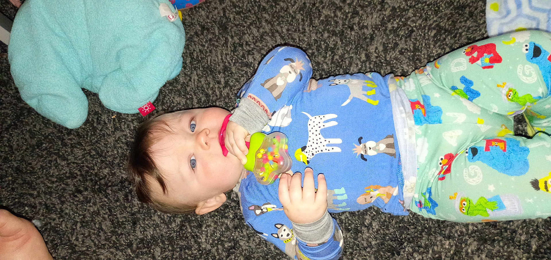 Christopher joined the competition — help win amazing prizes! baby, child, pajamas, carpet, toy, teether, blue_eyes, plush_toy, animal_print, lying_down, infant, cute, hand, face, clothing, floor, indoor, skin, person, young_child