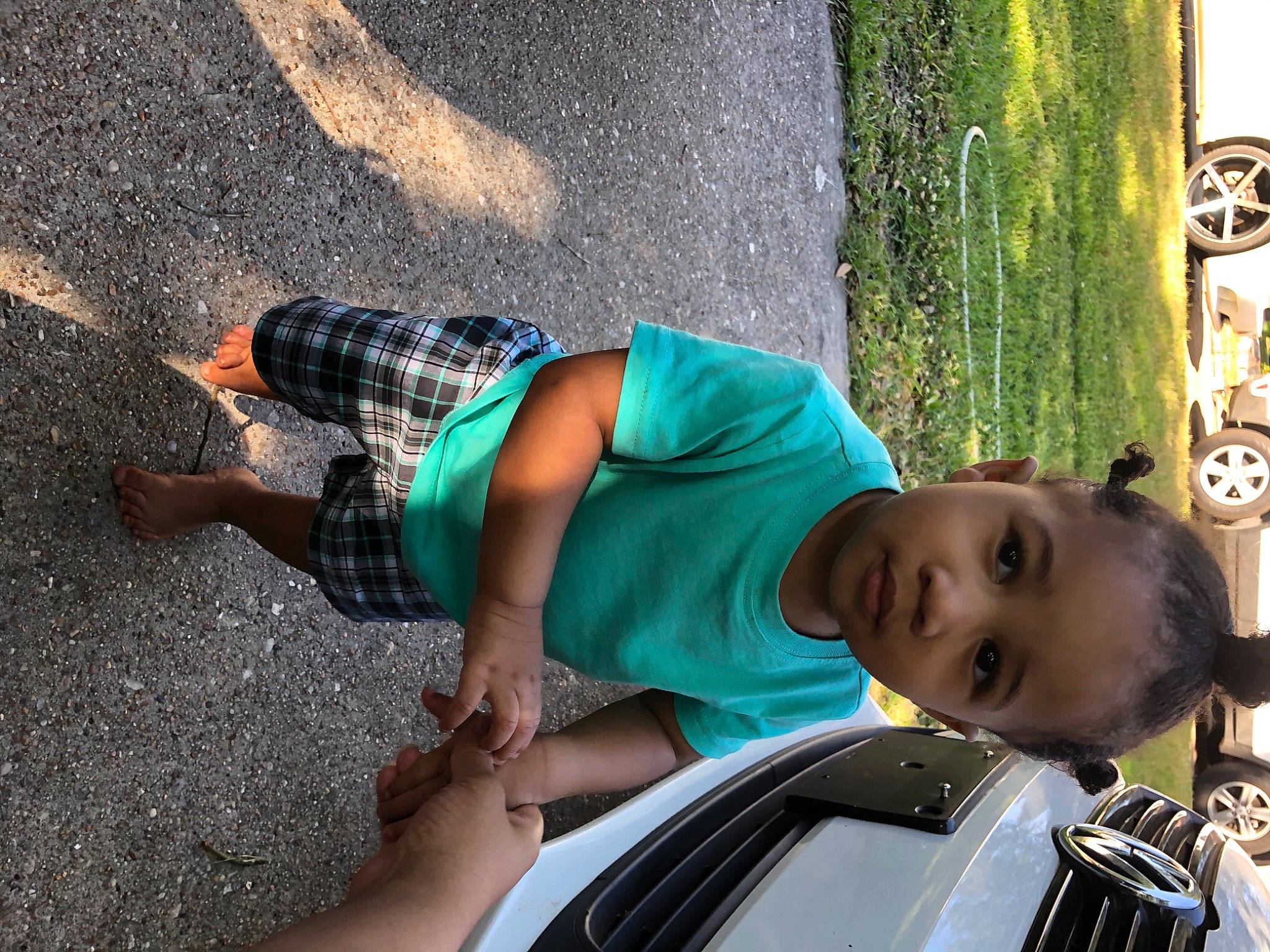 Tylan joined the competition — help win amazing prizes! automotive_design, automotive_exterior, automotive_lighting, bumper, dress, eyewear, family_car, fun, hood, human_leg, leisure, motor_vehicle, person, recreation, road, sunglasses, thigh, toddler, tree, vehicle_door