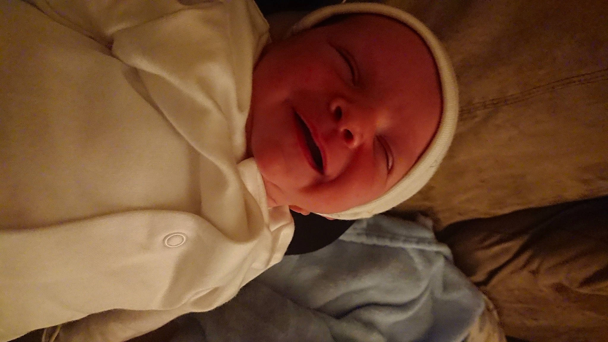 Joe is registered to the contest to win money with this photo: baby, baby_toddler_clothing, beige, brown, cheek, comfort, facial_expression, forehead, headwear, jaw, lip, person, skin, sleeve, tan, toddler