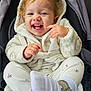 toddler, child, smiling, laughing, hooded_jacket, white_clothing, socks, stroller, baby, cute, happy, indoor, cozy, playful, person, face, hands, foot, casual_wear, infant