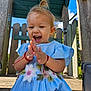 toddler, child, smiling, clapping, blue_dress, flower_embroidery, outdoor, playground, wooden_structure, happy, cute, sunny, daylight, earrings, blonde_hair, casual, nature, fun, joy, portrait