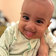 Jalal Ghazi Karrar is registered to the contest to win money with this photo: baby, babywear, child, closeup, clothing, cute, expression, face, hand, happy, head, indoor, infant, onesie, person, portrait, skin, smile, tongue, young