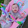 baby, smiling, infant, bouncer, outdoor, pajamas, toy, colorful, rainbow, animal_illustration, happy, child, seat, grass, concrete, playtime, cute, joyful, person, young