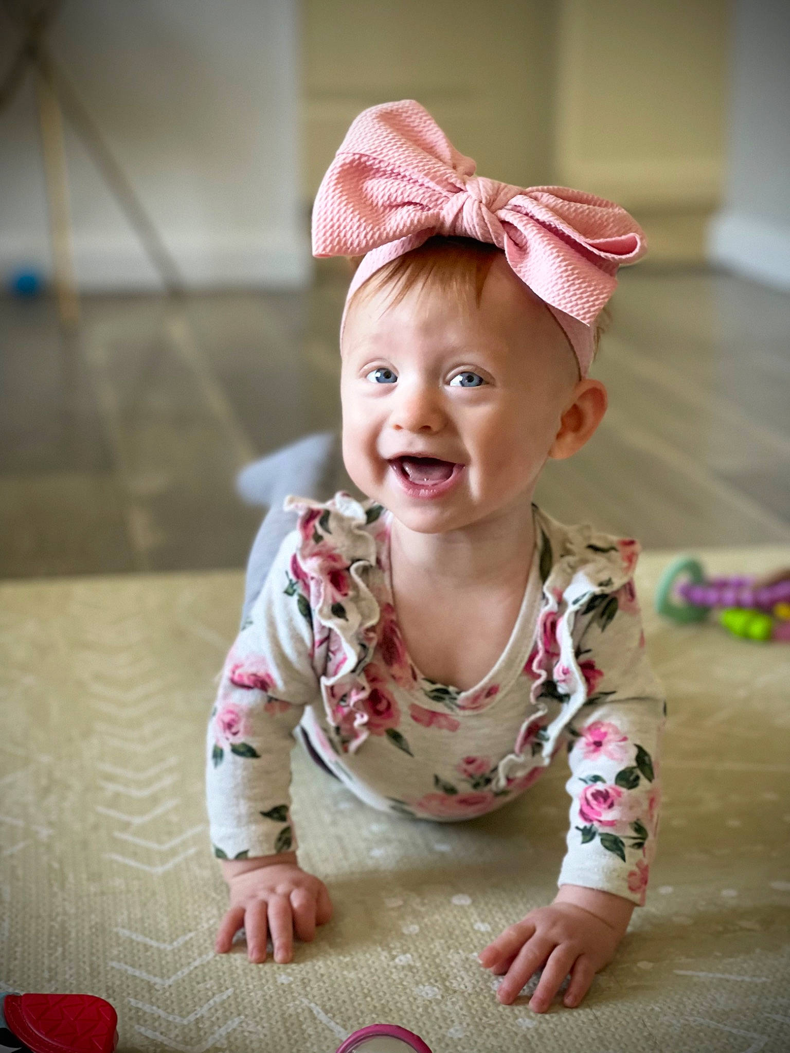 Colette joined the competition — help win amazing prizes! baby, baby_toddler_clothing, cap, child, dress, eye, face, facial_expression, floor, flooring, fun, happy, head, magenta, pattern, person, pink, skin, sleeve, smile