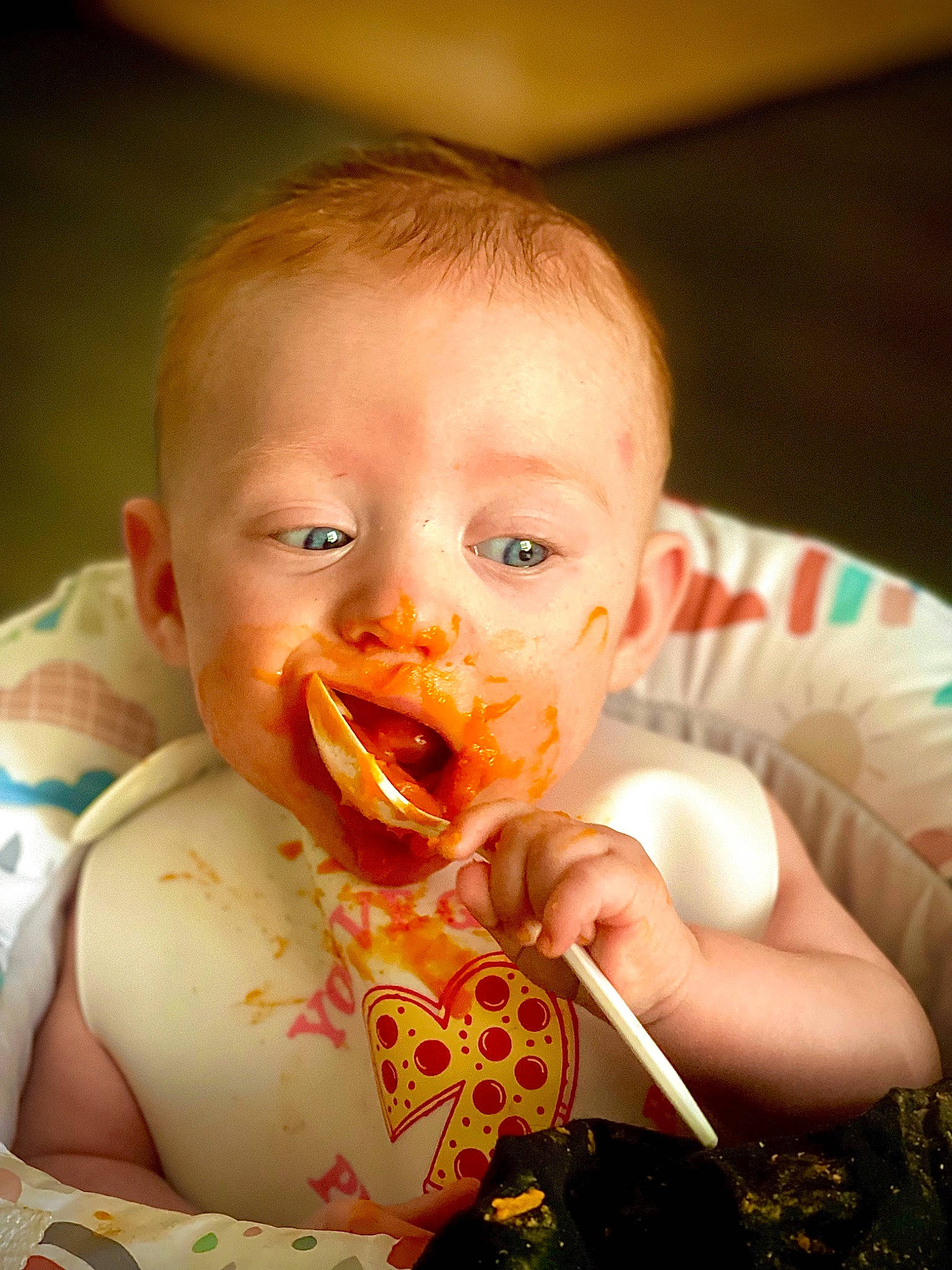 Colette is registered to the contest to win money with this photo: baby, baby_food, baby_playing_with_food, baby_toddler_clothing, biting, cheek, child, eating, eye, finger, food_craving, happy, head, iris, lip, mouth, nose, person, skin, sweetness