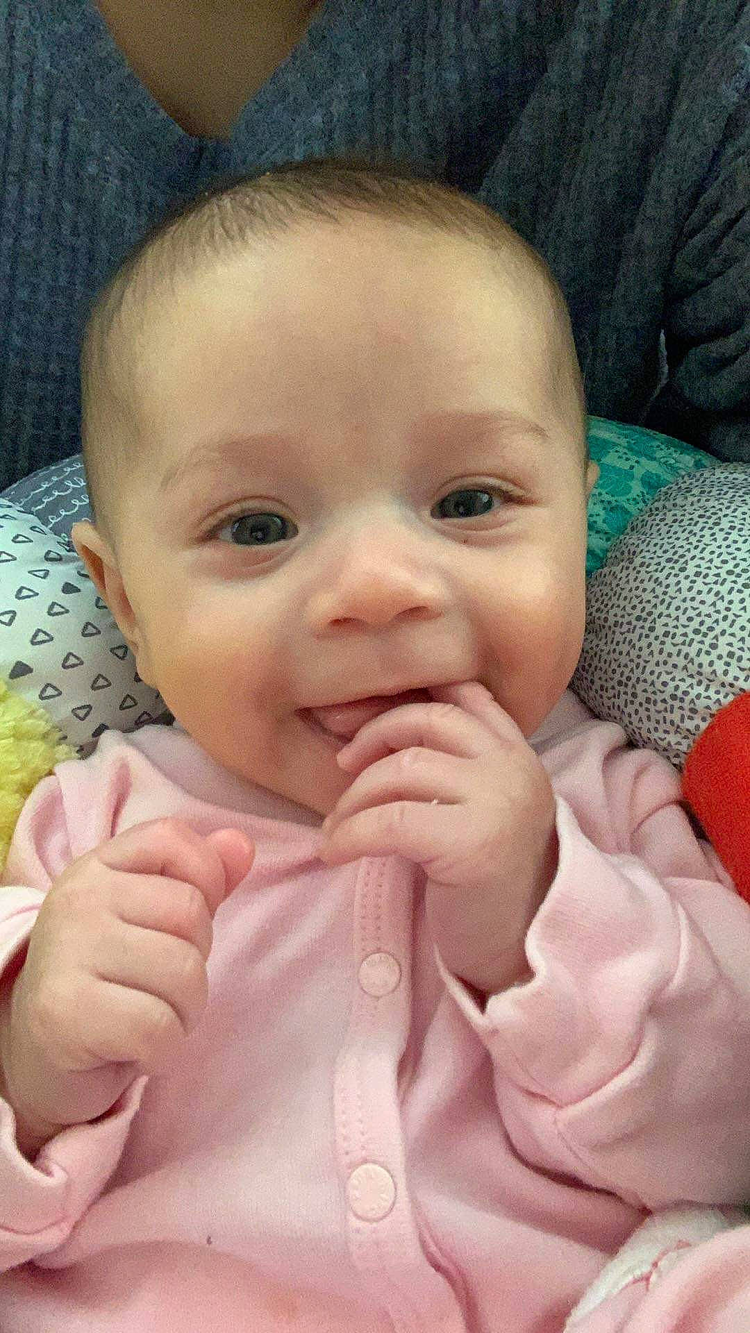 Amaya is registered to the contest to win money with this photo: baby, baby_toddler_clothing, cheek, chin, eye, eyebrow, eyelash, finger, gesture, happy, head, iris, lip, mouth, nose, person, pink, product, skin, sleeve