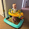Stetson joined the competition — help win amazing prizes! baby, walker, toy, indoor, carpet, smile, child, white_wall, doorway, playful, happy, feet, infant, yellow, blue, plastic, person, standing, cute, expression