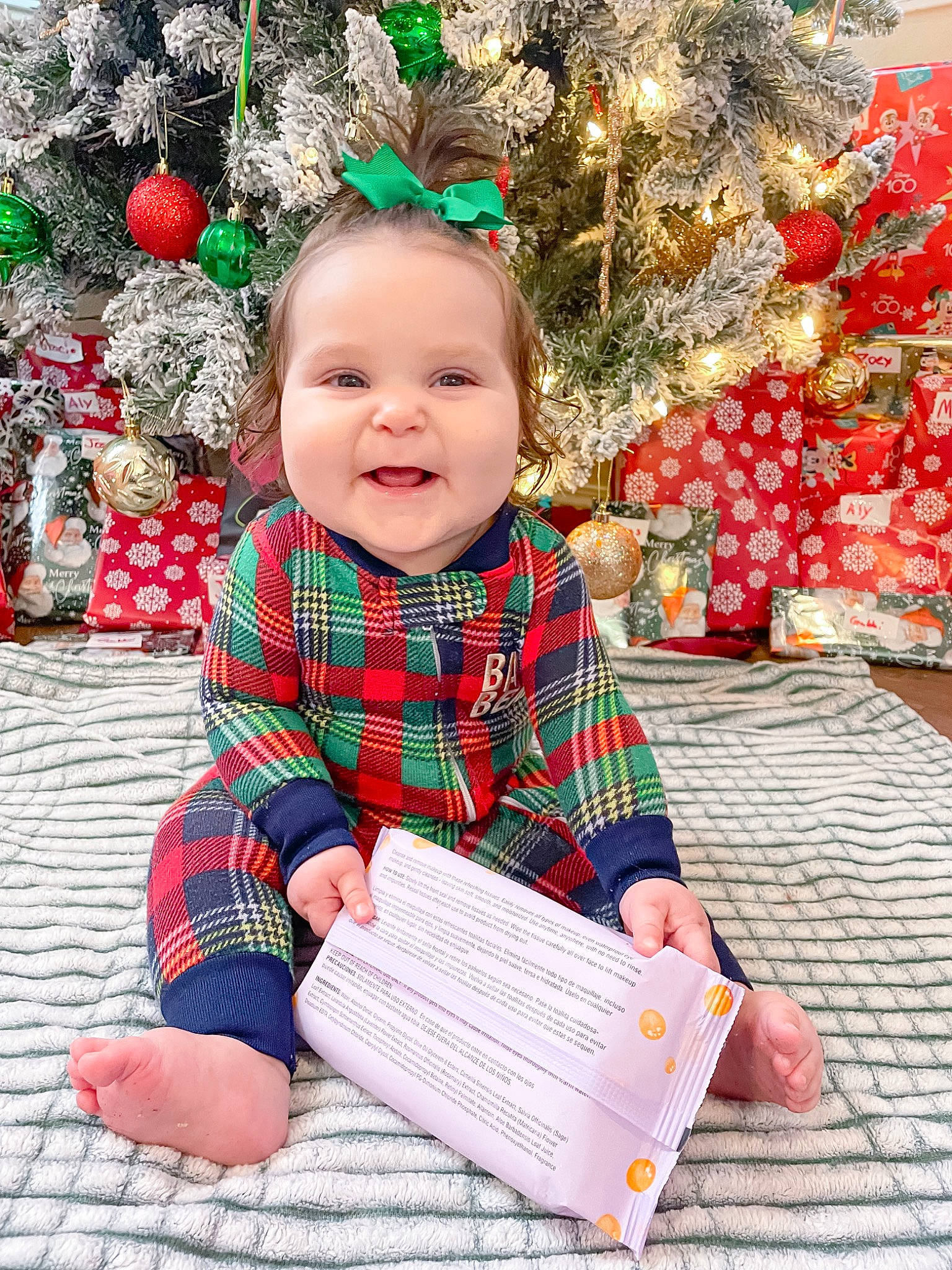 Graclynn joined the competition — help win amazing prizes! baby, baby_toddler_clothing, child, christmas_decoration, christmas_ornament, christmas_tree, event, fun, grass, happy, holiday, holiday_ornament, joy, ornament, outerwear, pattern, person, plaid, sleeve, smile