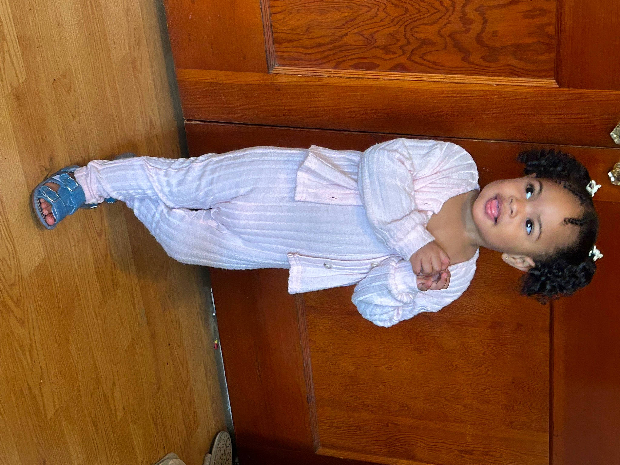 Alani is registered to the contest to win money with this photo: baby_toddler_clothing, child, comfort, elbow, flooring, fun, happy, hardwood, hat, human_leg, knee, person, room, sleeve, smile, toddler, varnish, wood, wood_stain, wrist