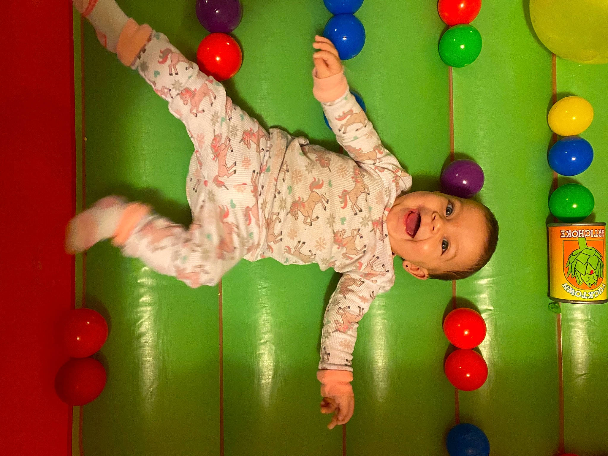 Penny joined the competition — help win amazing prizes! baby_toys, ball_pit, child, fun, gesture, green, happy, human_body, leisure, party_supply, person, photograph, play, playground, recreation, red, room, smile, snapshot, toddler