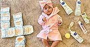 Beya participe au concours pour gagner de l'argent avec cette photo : baby, baby_bath, baby_care_products, brush, calm, child, cream, cute, diapers, headwrap, indoors, infant, lotion, lying_down, pink_clothing, robe, skincare, slippers, soft_carpet, toddler