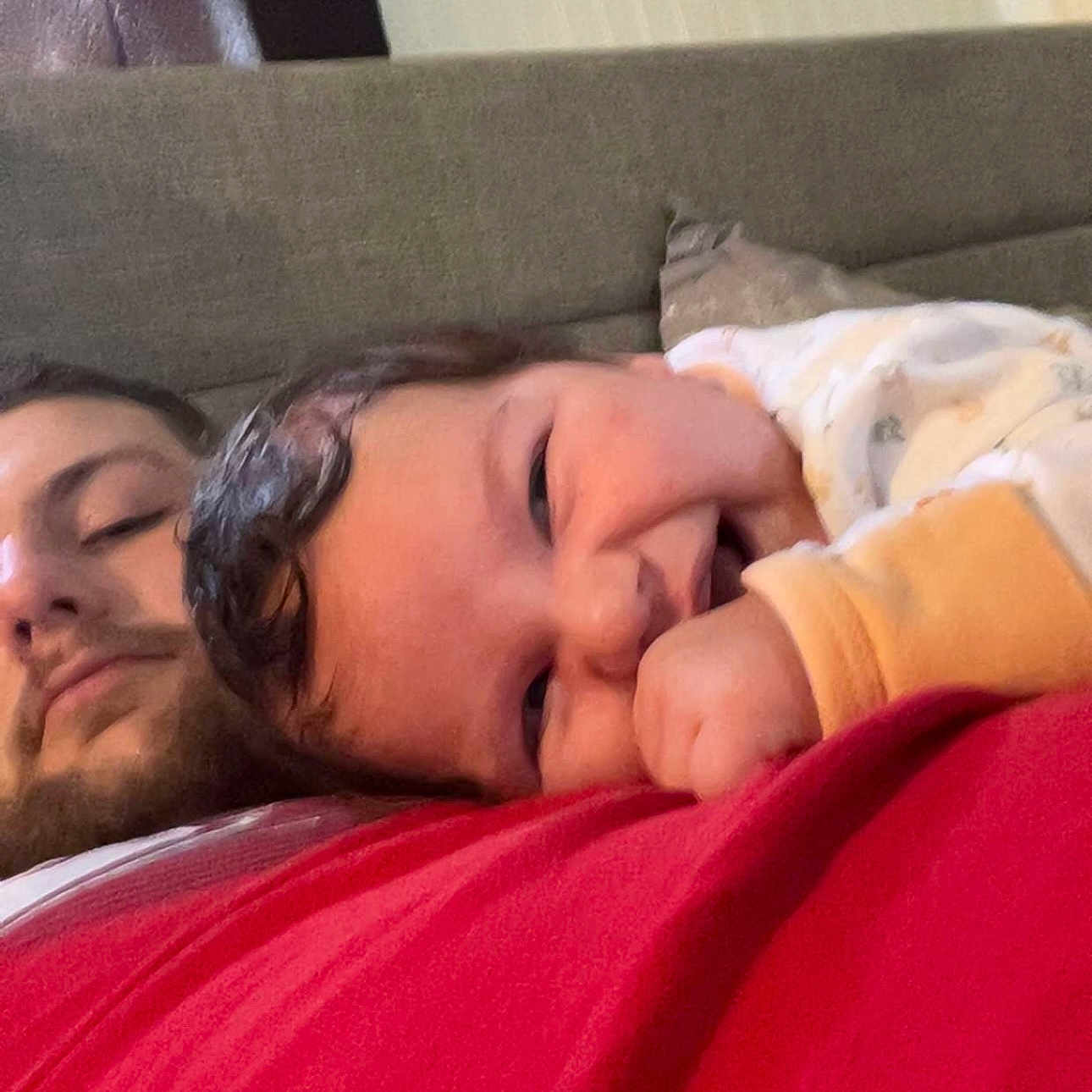 Taym joined the competition — help win amazing prizes! adult, baby, casual, closeup, comfort, couch, curly_hair, face, family, hand, happy, indoor, love, person, portrait, red_shirt, relaxed, resting, skin, smiling