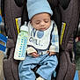 baby, car_seat, bottle, sleeping, hat, bib, milk, clothing, infant, footwear, socks, blue_pants, plaid_shirt, indoor, child, cute, peaceful, resting, toddler, baby_bottle