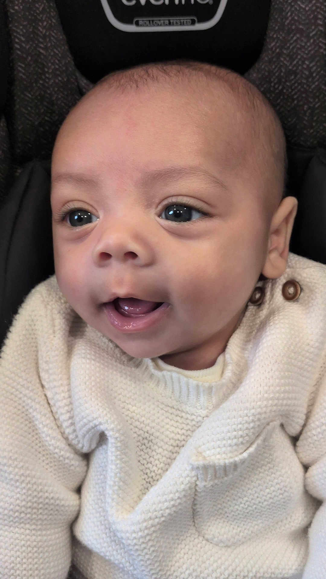 Evin Collin joined the competition — help win amazing prizes! baby, infant, face, eyes, sweater, knitted, white_clothing, cute, child, expression, portrait, closeup, skin, mouth, head, person, young_child, happy, warm, cozy