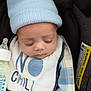 Evin Collin joined the competition — help win amazing prizes! baby, sleeping, blue_hat, bib, car_seat, bottle, plaid_clothing, peaceful, infant, child, cute, face, closed_eyes, cozy, soft, resting, newborn, indoor, portrait, toddler