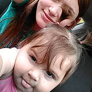 Chevelle Steptoe is registered to the contest to win money with this photo: child, toddler, woman, selfie, car, seat, hair, smile, tongue_out, face, person, casual, portrait, young, fun, playful, happy, together, indoor, clothing