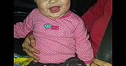 Chevelle Steptoe is registered to the contest to win money with this photo: adult_hand, app_interface, baby, car_seat, child, cute, happy, indoor, infant, person, pink_clothing, polka_dots, portrait, screen, screenshot, sitting, smiling, social_media, technology, young_child