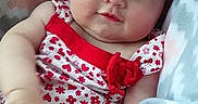Nova joined the competition — help win amazing prizes! baby, child, infant, blanket, pattern, clothing, red, white, floral, cute, portrait, face, skin, hand, smile, sitting, cozy, soft, indoors, person