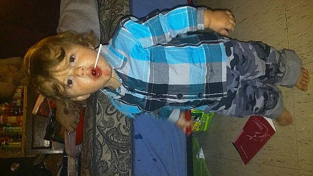 Charlie is registered to the contest to win money with this photo: child, fun, pattern, person, room, sitting, toddler, visual_arts