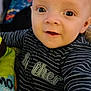 Joshua Corey is registered to the contest to win money with this photo: baby, baby_clothes, child, closeup, cute, eyes, face, hand, happy, indoor, infant, person, plush_toy, portrait, seated, smiling, soft_toy, striped_clothing, toy, young_child