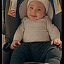 baby, beanie, booties, car_interior, car_seat, cheeks, cozy, cute, date_stamp, eyes, hands, head_support, infant, onesie, portrait, safety_label, smile, smiling, socks, warning_label