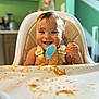 Fox joined the competition — help win amazing prizes! baby, high_chair, food, messy, smiling, happy, spoon, child, face, kitchen, meal, feeding, infant, cute, tongue_out, table, indoor, person, eating, seat
