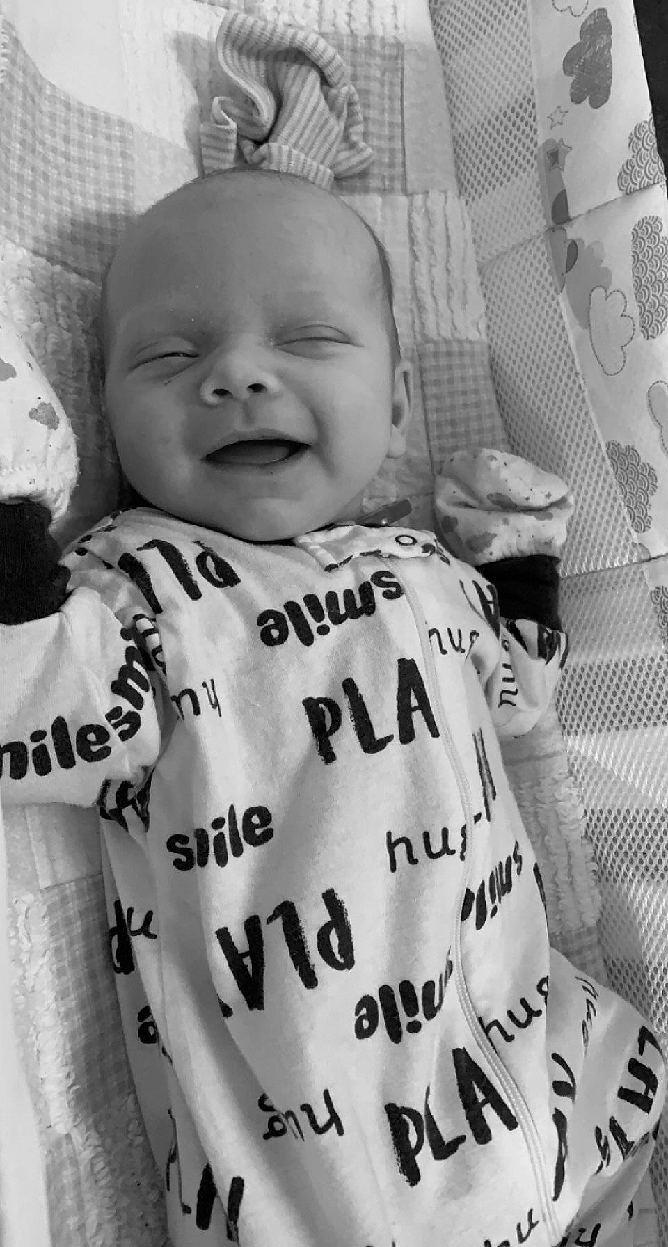 Kamden is registered to the contest to win money with this photo: baby, baby_toddler_clothing, black, black_and_white, cheek, eye, face, facial_expression, gesture, grey, happy, human, outerwear, person, photograph, product, sleeve, smile, style, textile