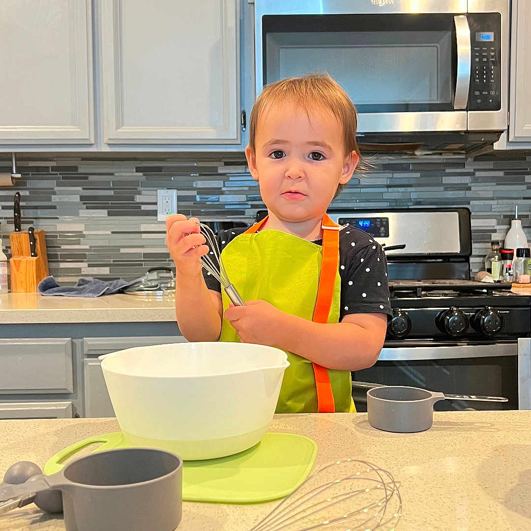 Ella joined the competition — help win amazing prizes! appliance, bowl, boy, child, cooktop, cutlery, device, dish, electricaldevice, food, indoors, interiordesign, kitchen, male, meal, microwave, mixingbowl, oven, person, spoon