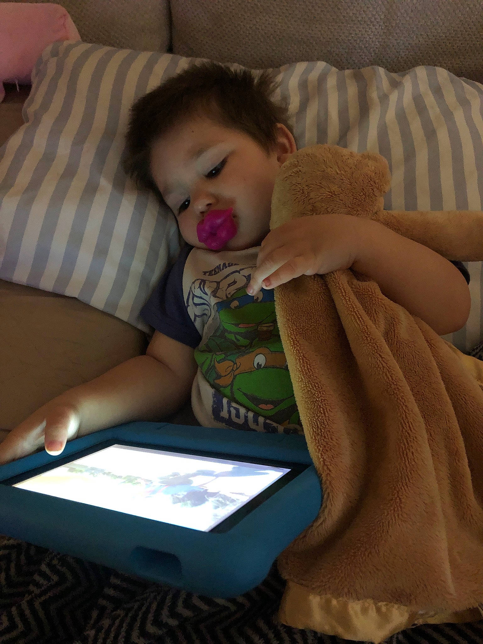Treyson is registered to the contest to win money with this photo: baby, bedtime, child, comfort, electronic_device, nap, person, reading, sleep, technology, toddler