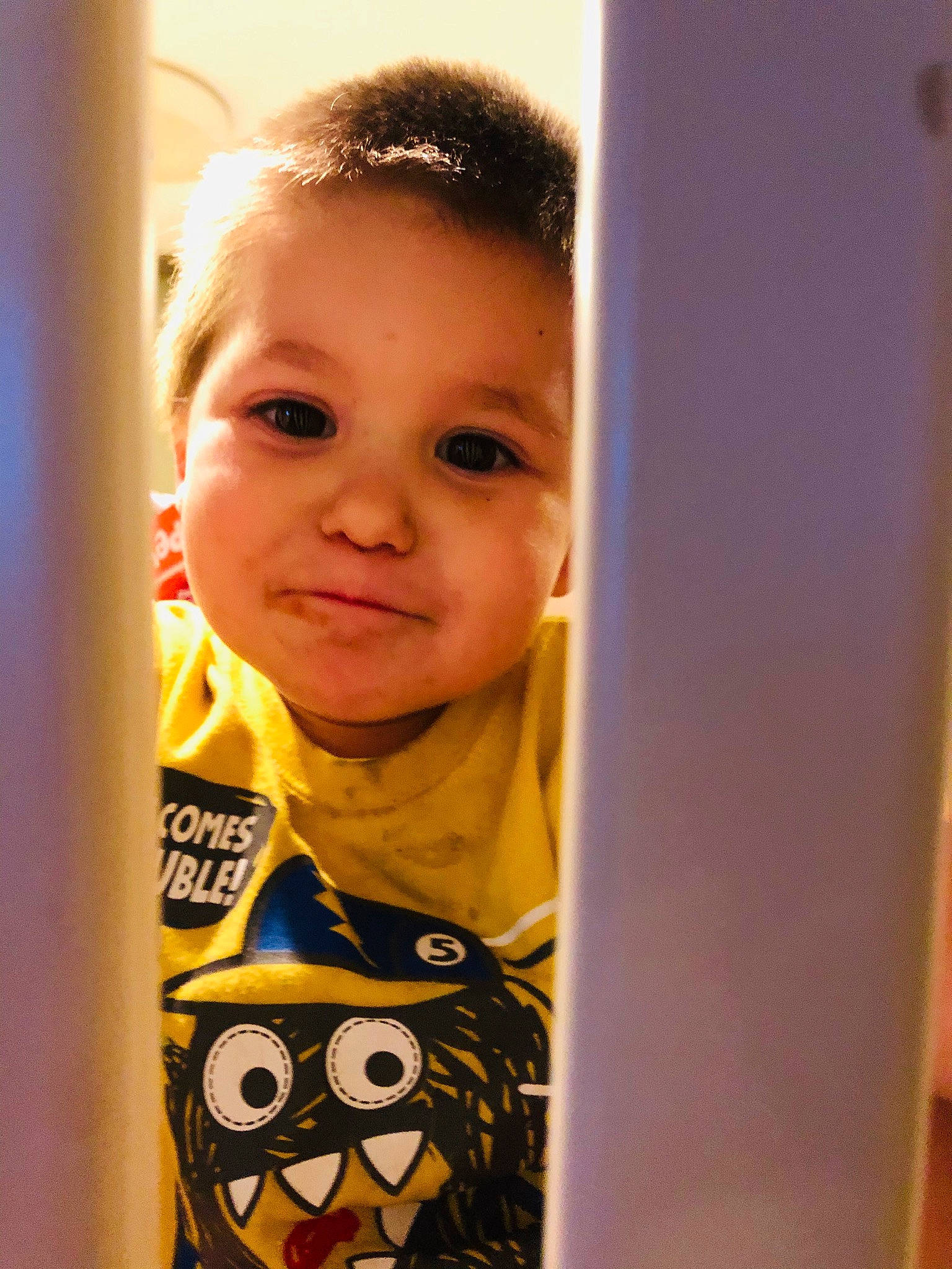 Treyson is registered to the contest to win money with this photo: cheek, child, face, forehead, head, person, smile, standing, toddler, yellow