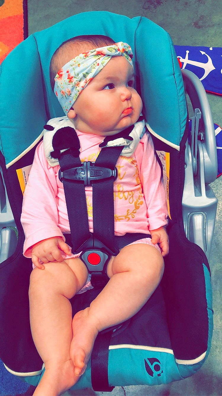 Taylor is registered to the contest to win money with this photo: baby, baby_carriage, baby_in_car_seat, baby_products, car_seat, cheek, child, fun, headgear, person, pink, play, product, sitting, skin, toddler, vacation