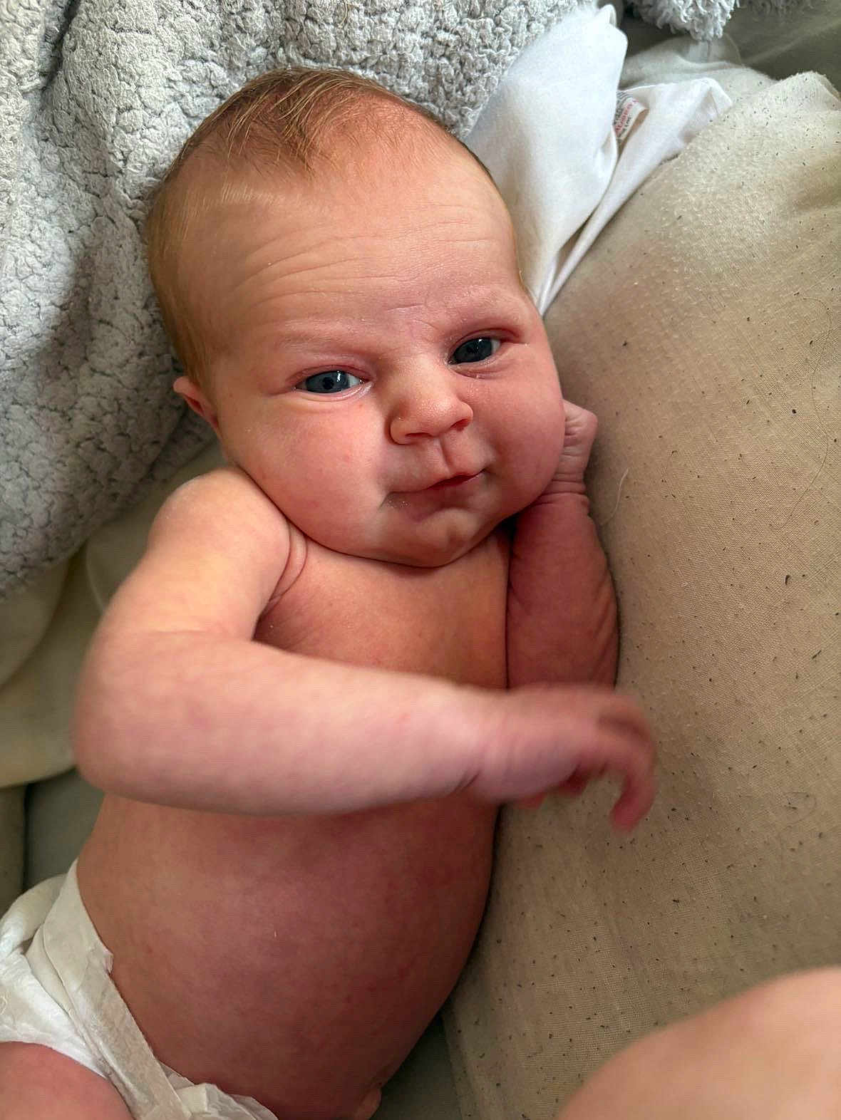 Gracie Mo joined the competition — help win amazing prizes! baby, infant, skin, blue_eyes, diaper, blanket, pillow, arm, face, expression, newborn, cute, soft, comfort, resting, human, child, indoors, closeup, relaxed