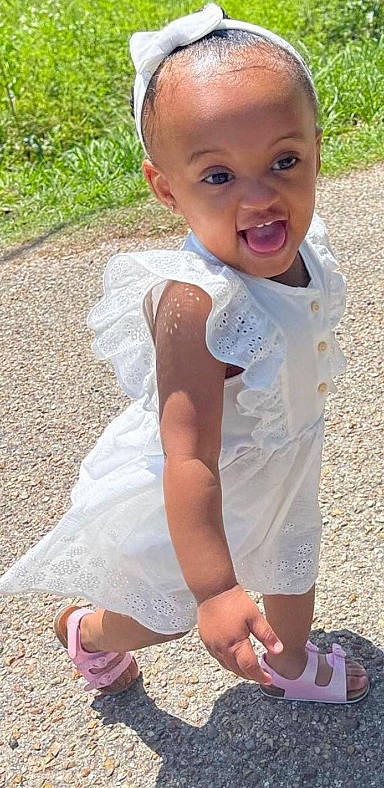 Makana joined the competition — help win amazing prizes! baby_toddler_clothing, child, dress, face, fun, grass, happy, head, joint, leg, people, people_in_nature, person, photograph, pink, shoe, skin, sleeve, smile, toddler