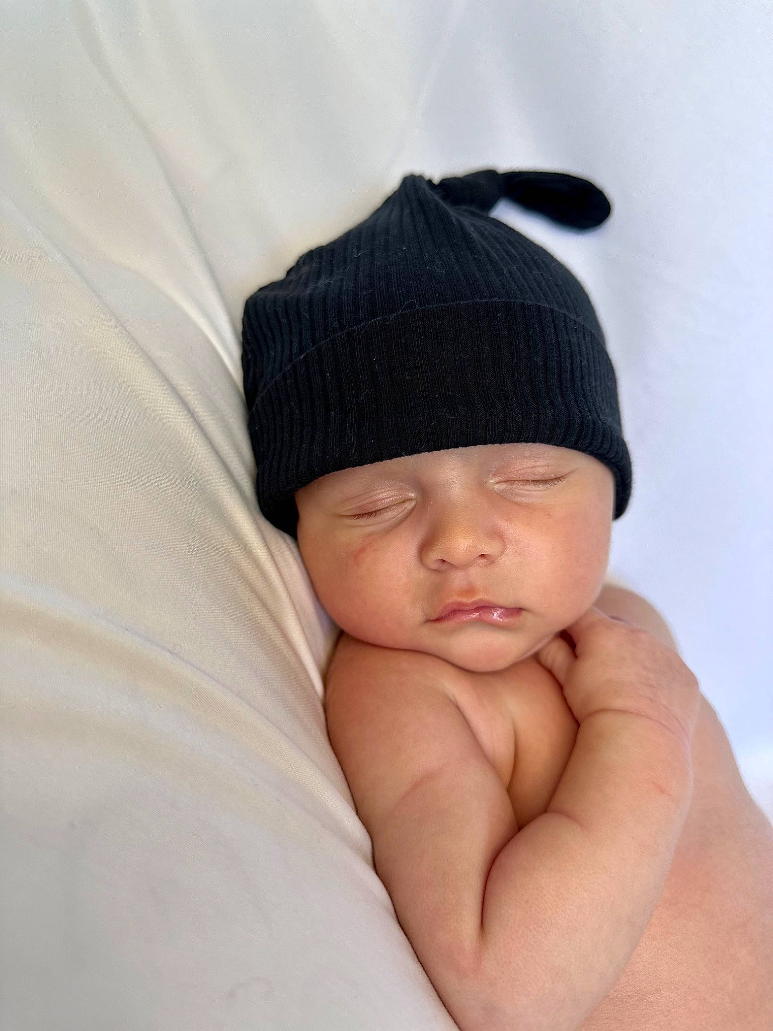 Hendrix joined the competition — help win amazing prizes! baby, baby_sleeping, beanie, cap, comfort, fashion_accessory, hair_accessory, hand, head, headgear, headwear, human_body, knit_cap, linens, magenta, nail, person, sitting, thumb, toddler