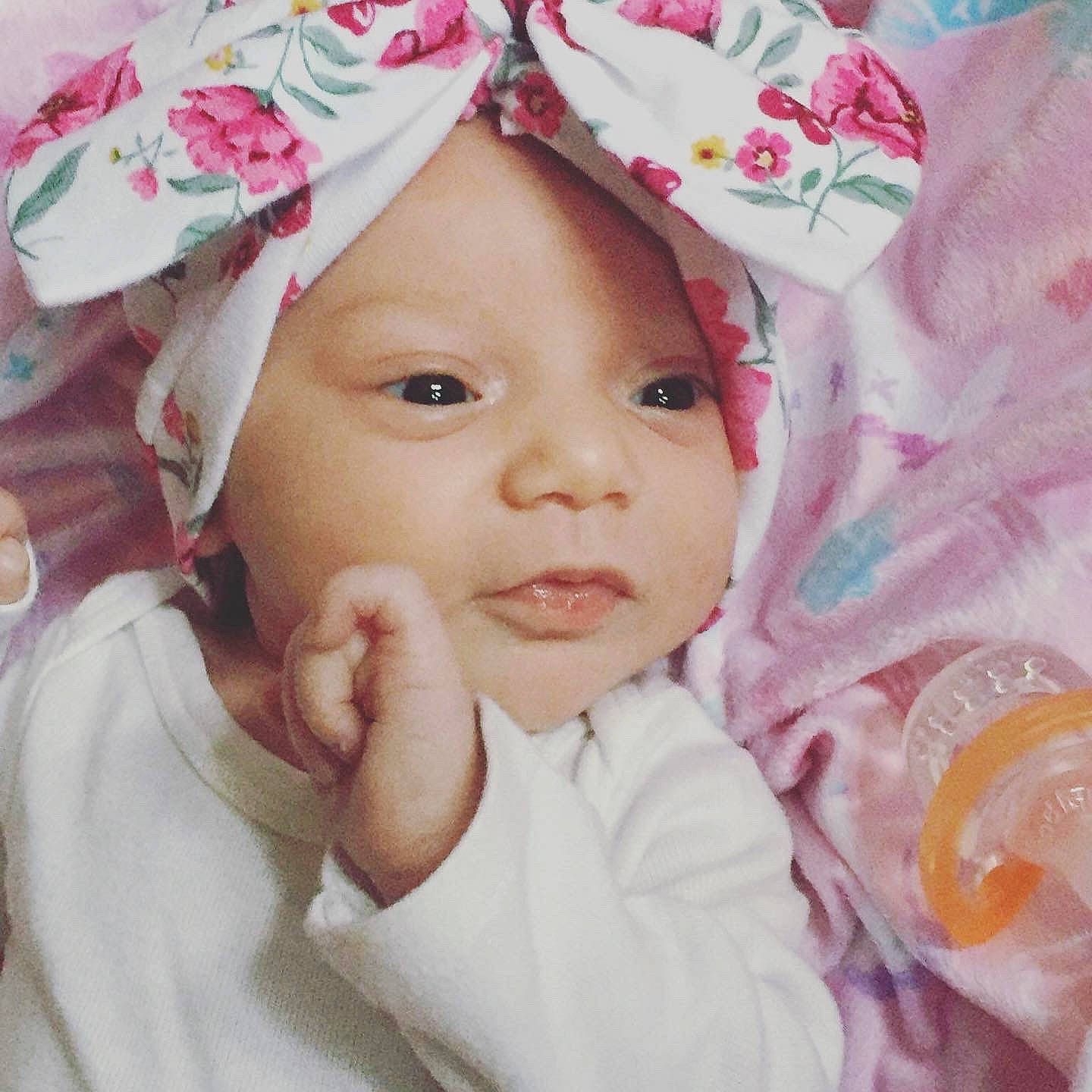 Alaiya is registered to the contest to win money with this photo: baby, beauty, cheek, child, eye, face, hair_accessory, happy, head, headgear, headwear, lip, nose, person, photography, pink, plant, portrait, product, skin