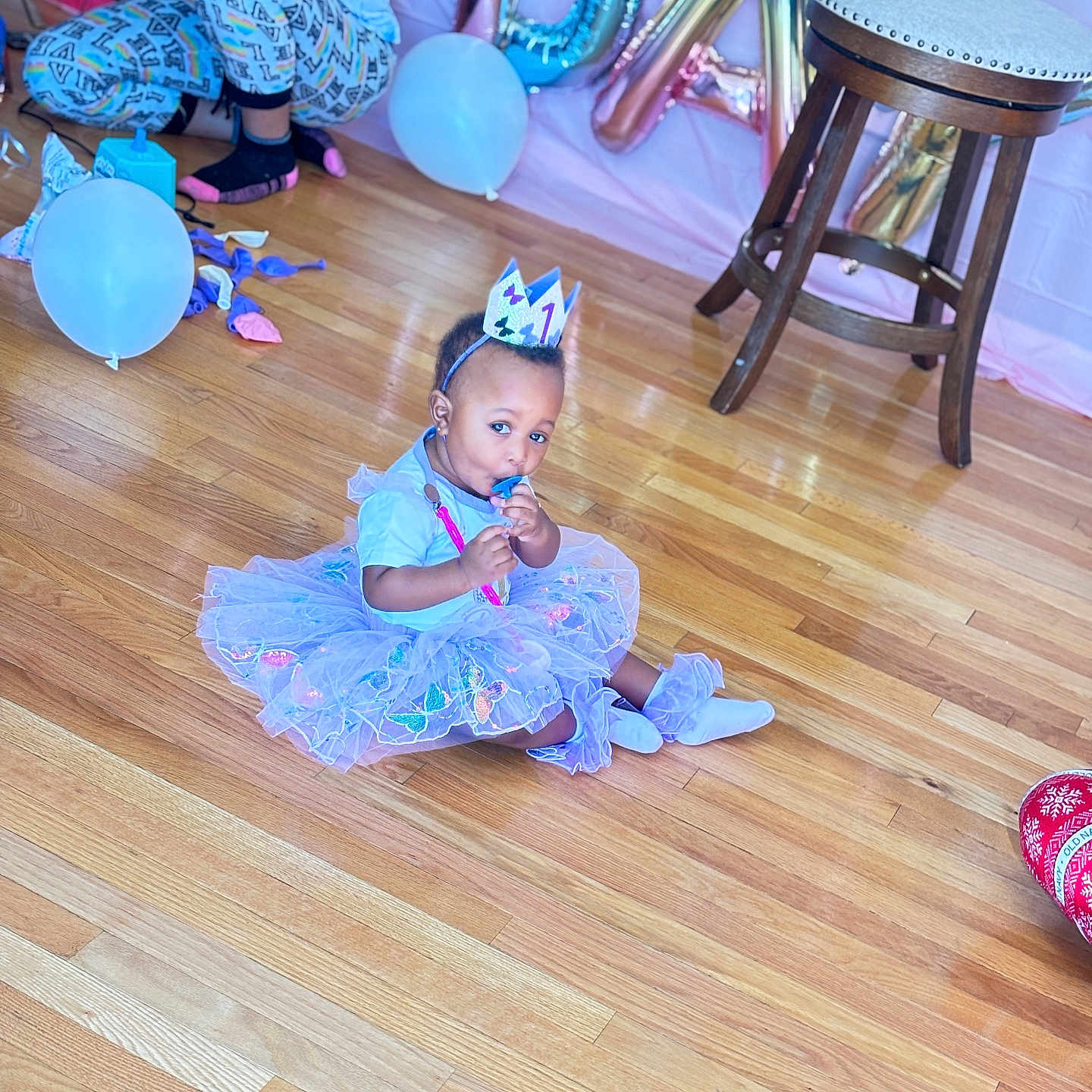 Wyzdom is registered to the contest to win money with this photo: balloon, child, clothing, costume, dress, face, female, furniture, girl, hardwood, hat, head, indoors, interiordesign, people, person, photography, portrait, purple, wood