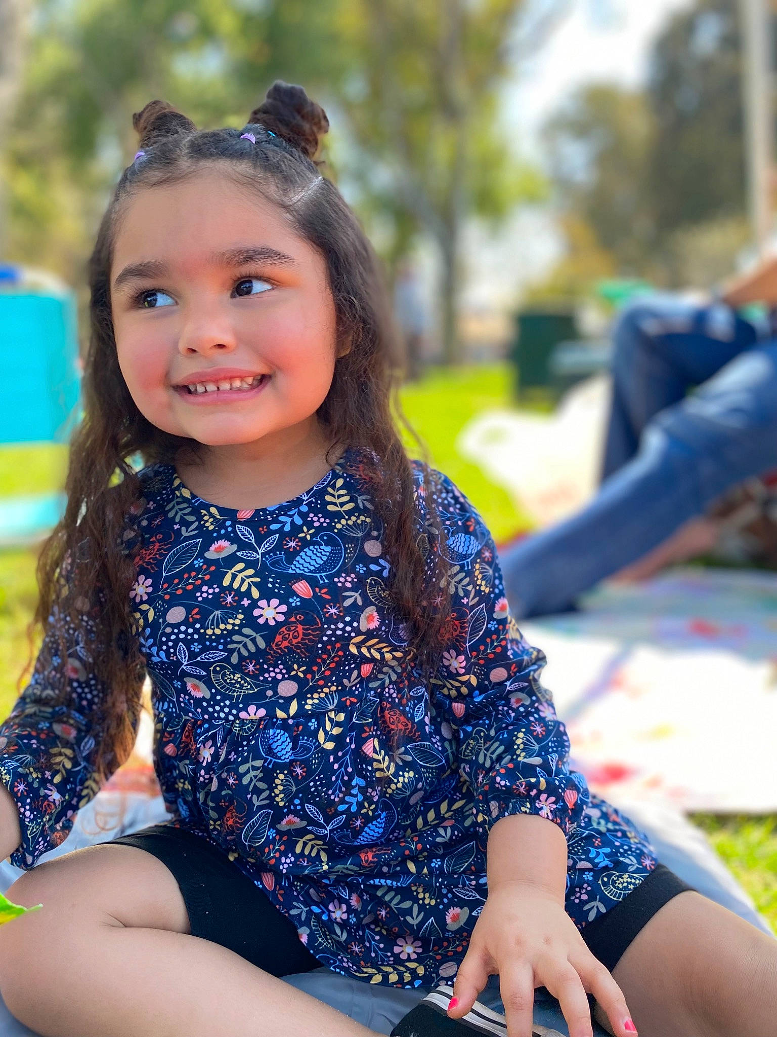 Maliyah is registered to the contest to win money with this photo: child, dress, electric_blue, event, fun, goggles, grass, happy, human_leg, joy, leisure, pattern, person, photo_shoot, portrait_photography, recreation, sitting, smile, sunglasses, thigh