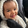 Neydee a rejoint le concours — aidez-le/la à gagner de superbes lots ! baby, child, smiling, hoodie, fluffy_clothing, car_seat, seatbelt, closeup, face, tongue_out, infant, cute, happy, indoors, person, black_straps, soft_texture, warm_clothing, portrait, baby_fashion