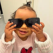 Neydee a rejoint le concours — aidez-le/la à gagner de superbes lots ! toddler, child, sunglasses, pink_sweater, minnie_mouse, smile, happy, cute, indoors, portrait, person, clothing, hand, hair, face, playful, fashion, baby, eyewear, accessory