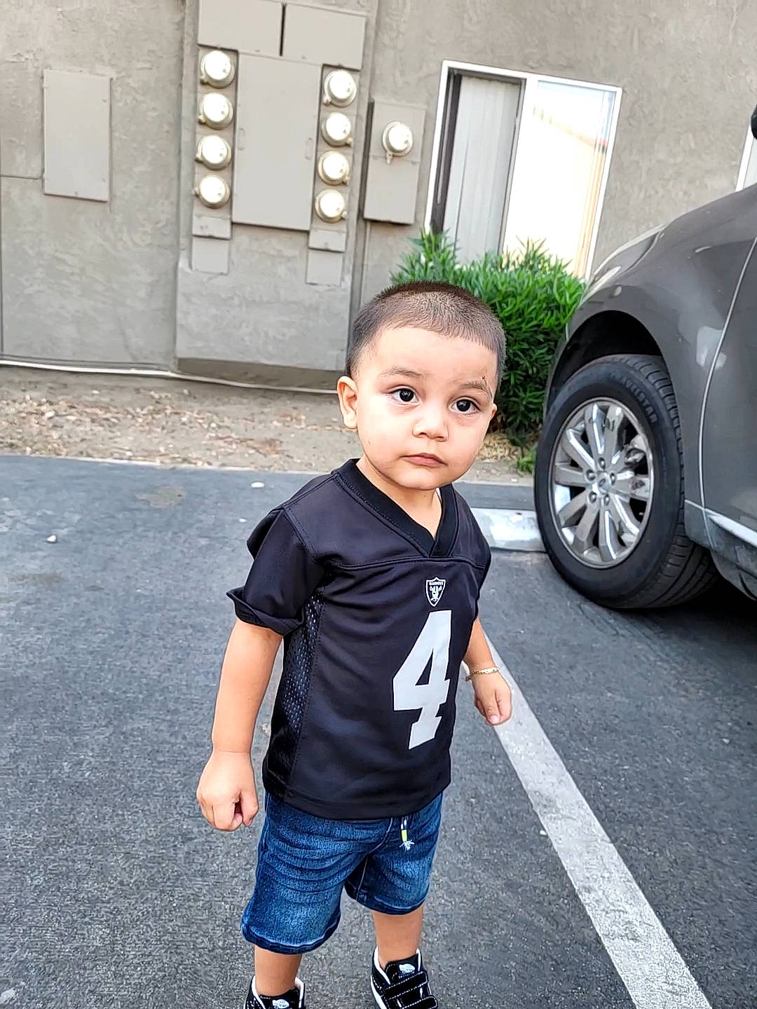 Mikey joined the competition — help win amazing prizes! asphalt, automotive_lighting, automotive_tire, black, car, electric_blue, fender, motor_vehicle, person, photograph, plant, shorts, standing, t_shirt, tints_and_shades, tire, toddler, vehicle, vehicle_door, wheel