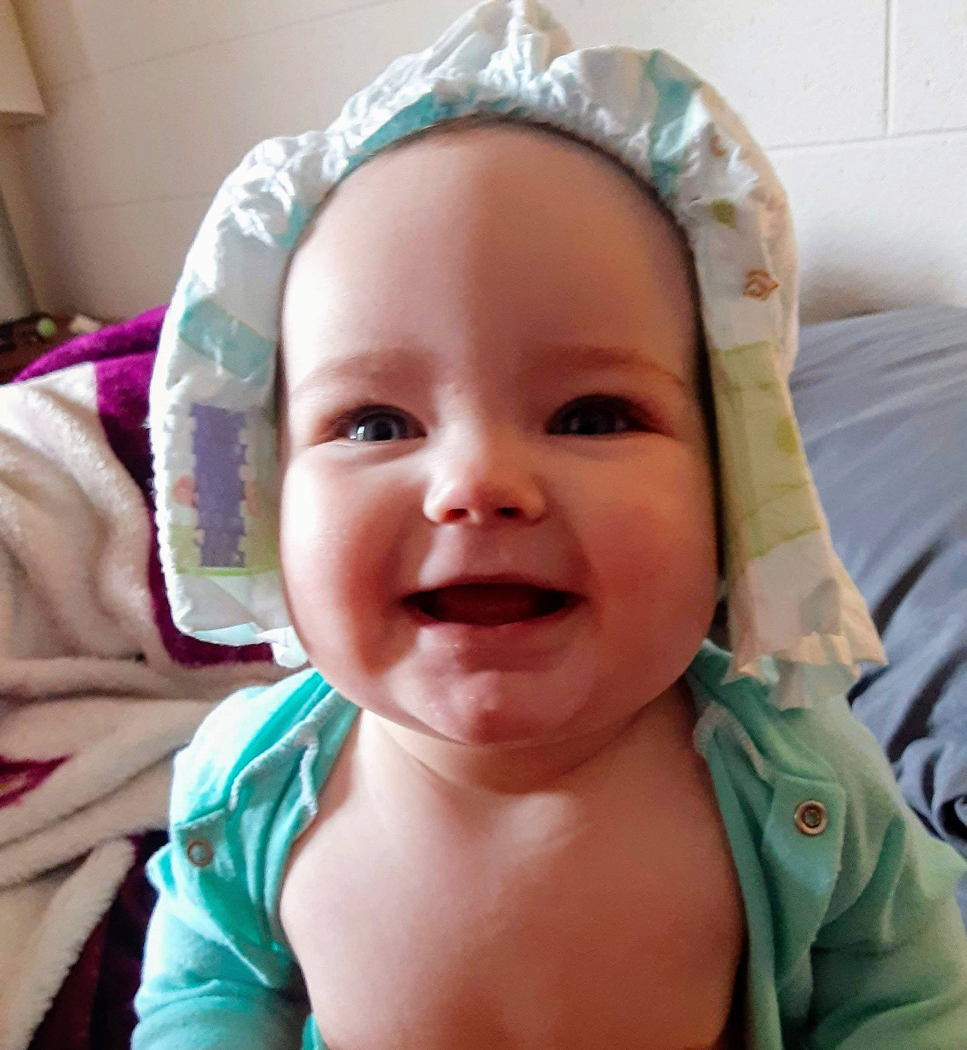 Izzy is registered to the contest to win money with this photo: baby, baby_making_funny_faces, cheek, child, chin, ear, eye, face, facial_expression, forehead, happy, head, headgear, joy, laugh, lip, mouth, nose, person, skin