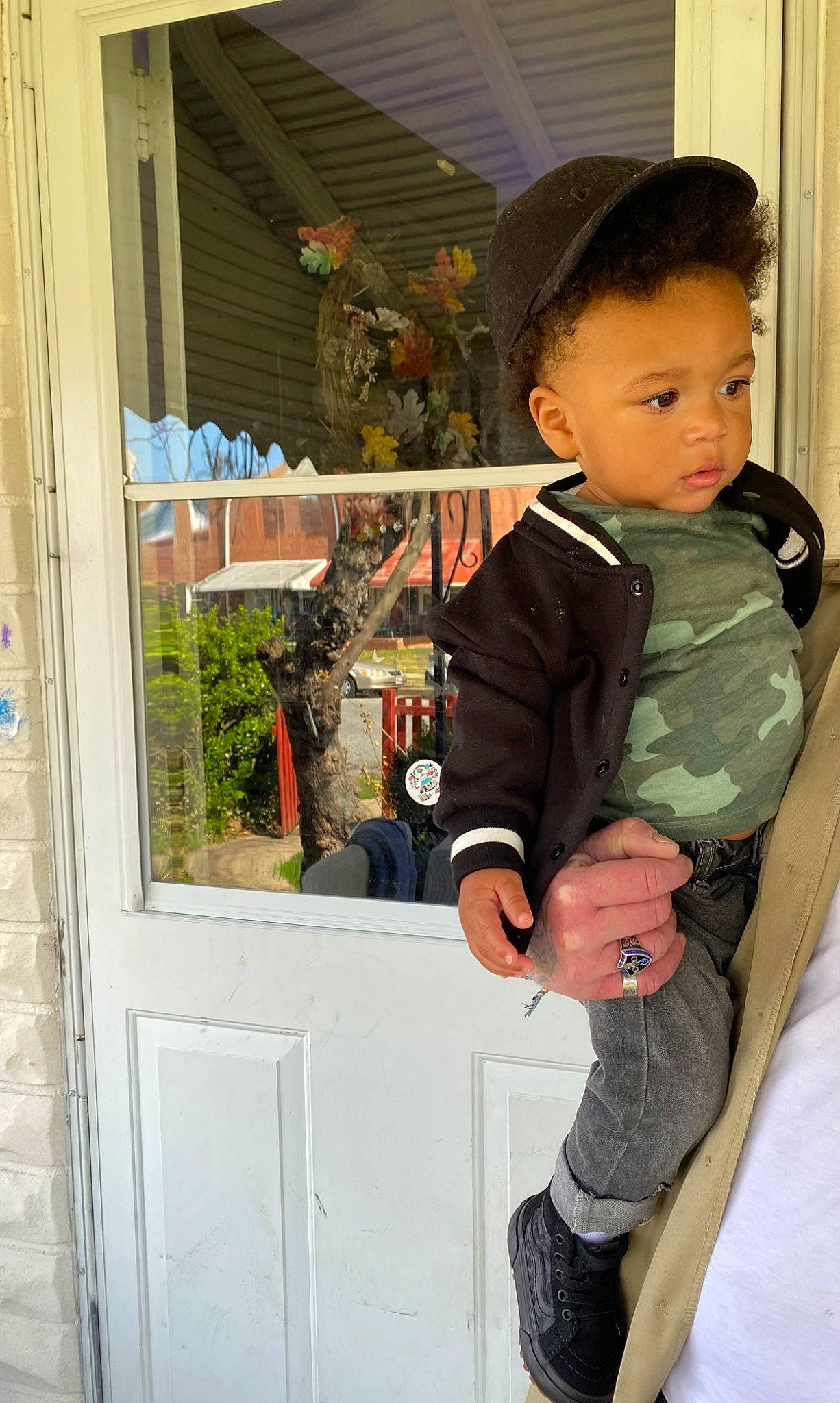 Fortune is registered to the contest to win money with this photo: baby_toddler_clothing, child, denim, door, fun, hat, home_door, person, plant, room, sitting, sleeve, t_shirt, toddler, vacation